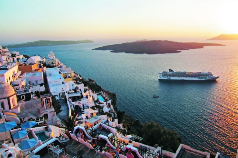 Norwegian Jade off the coast of Santorini Greece at sunset