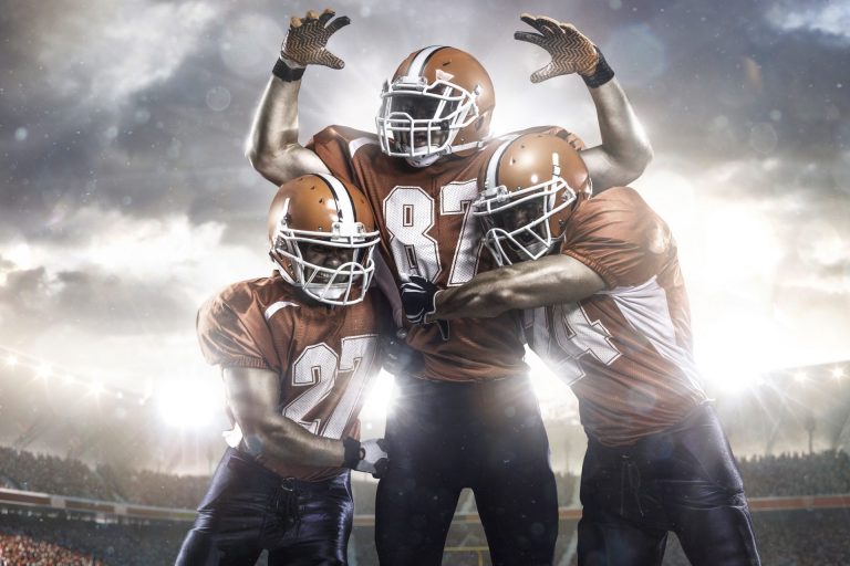 American football players in action on the stadium